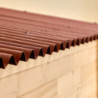 Abri en bois massif 12m² – madriers 28mm + couverture plaques ondulées