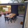 Pergola bioclimatique aluminium anthracite 10,80m² toit avec lames ovales aluminium + ventelles latérales pour côté 3m – HABRITA
