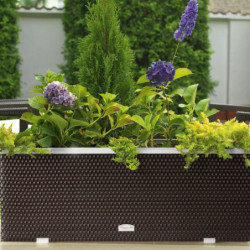 Bac à plantes 108x39x43cm en résine tressée marron foncé nuancé et acier galvanisé Rattan Art