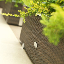 Bac à plantes 108x39x43cm en résine tressée marron foncé nuancé et acier galvanisé Rattan Art
